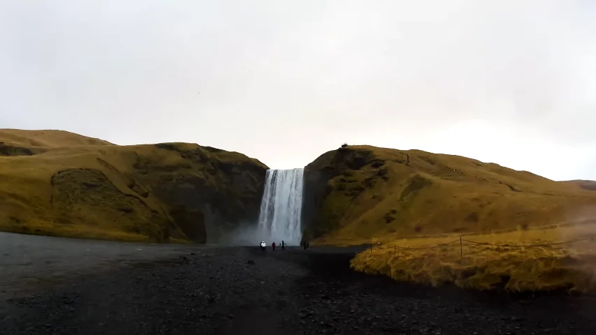 Waterfalls in Iceland flowing through dramatic green valleys and glacial landscapes